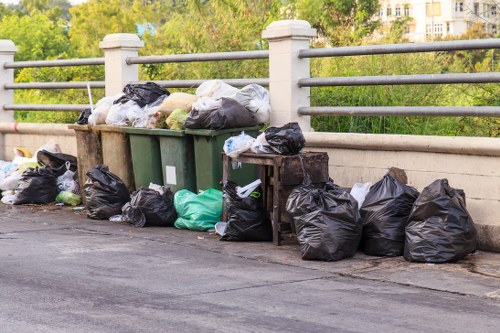 Waste collection trucks transporting debris